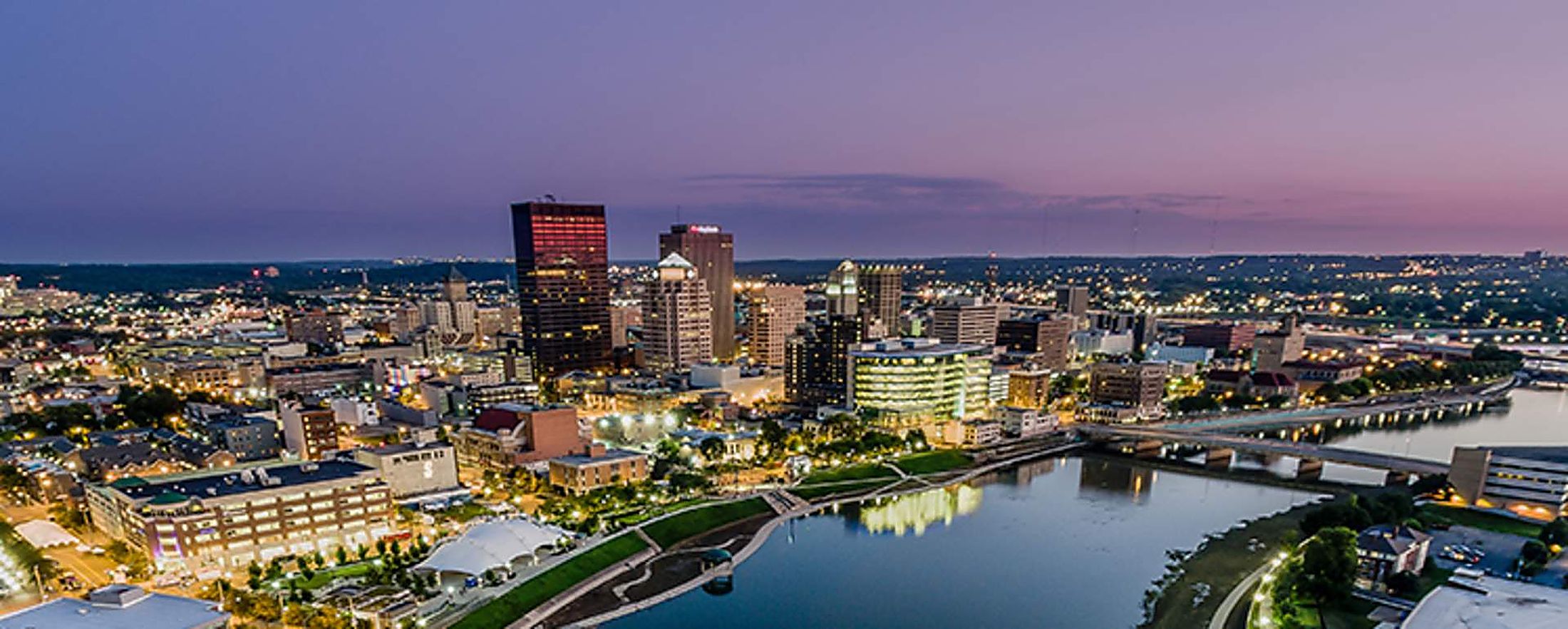 Downtown Dayton at dusk, seen from above the Great Miami River